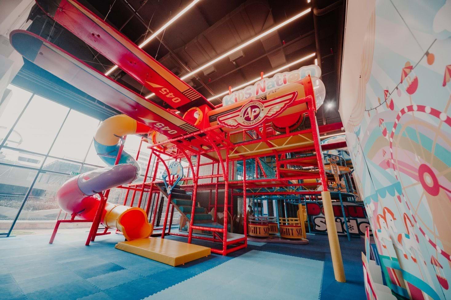 Kids Nation indoor playground — colourful play structure with slides and climbing frames